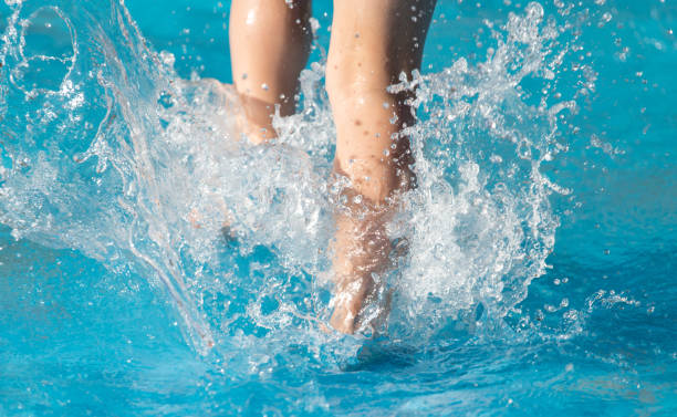 istock foot boy in the pool 882829902