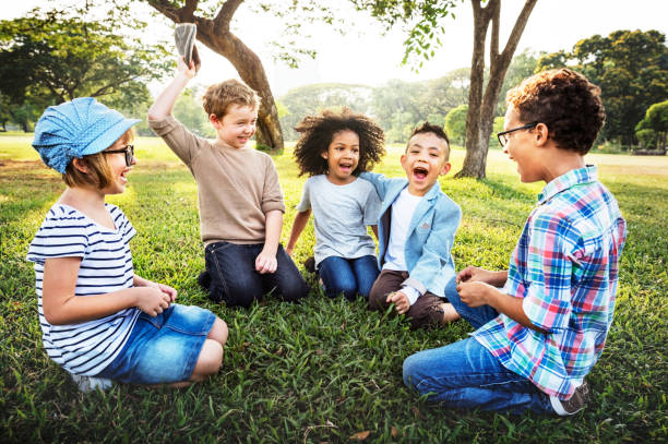 istock Happy kids in the park 882830614