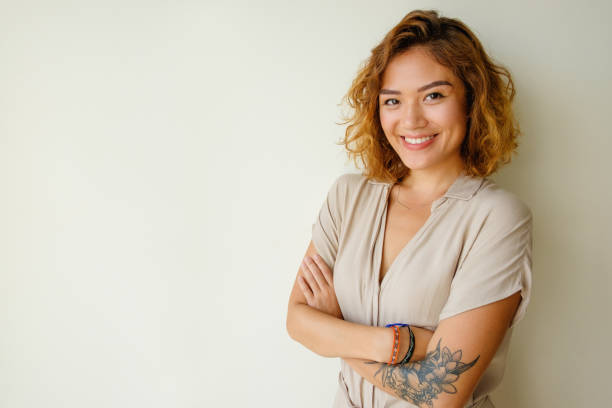 istock Portrait of cheerful tattooed model in studio 882842944