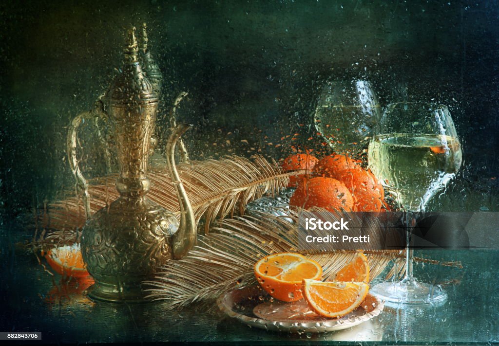 Still life with white wine and oranges Branch - Plant Part Stock Photo