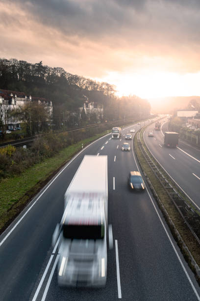 istock Highway trafic at sunset. Road transportation. Heavy traffic on freeway. 882851454
