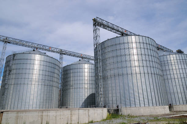 istock Agricultural Silos. Metal grain facility with silos. 882851644