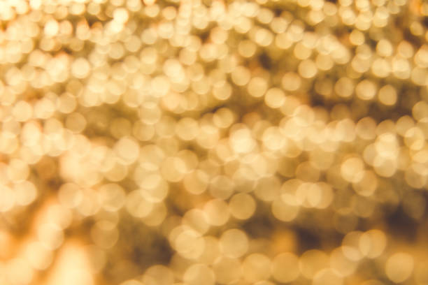 istock abstract defocused blurred gold background. christmas background 882856880