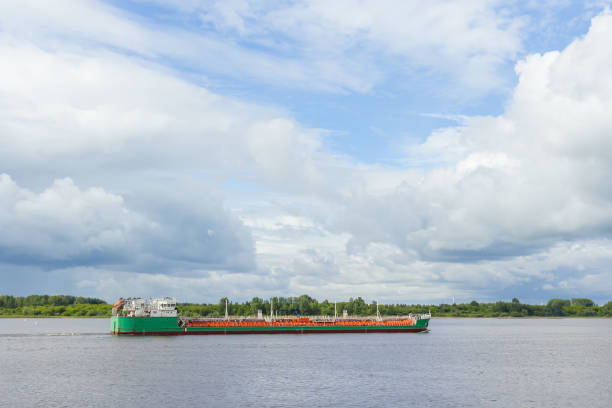 istock A green tanker is walking along the river 882857296