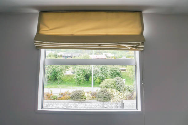 istock beige curtain at the window in bedroom 882859626