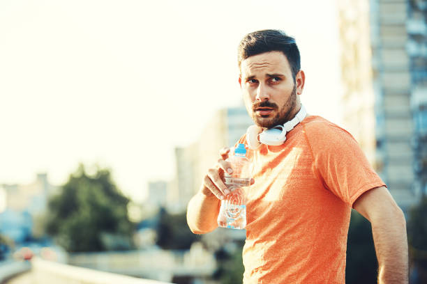 istock Sportive Young Man Exercising 882860240