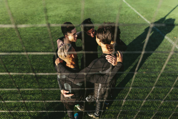 istock Five a side football team in circle 882866468