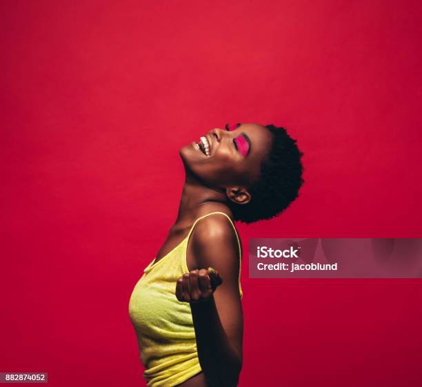 Cheerful Young Woman Dancing In Studio Stock Photo - Download Image Now - Women, Dancing, One Woman Only