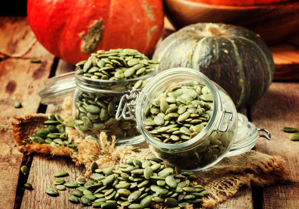 istock Raw pumpkin seeds, healthy snack 882874580