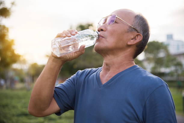 istock Asian senior male drinking water. 882874658