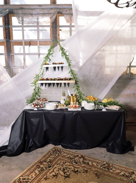 istock Catering, a wedding table with champagne, fruits, snacks 882881962