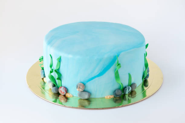 istock Art cake designed in the form of an underwater world with algae and pebbles. 882884962