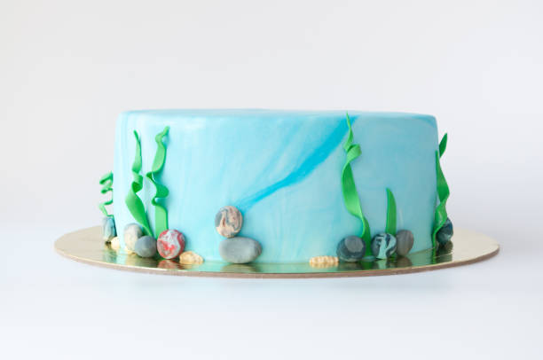 istock Art cake designed in the form of an underwater world with algae and pebbles. 882884970