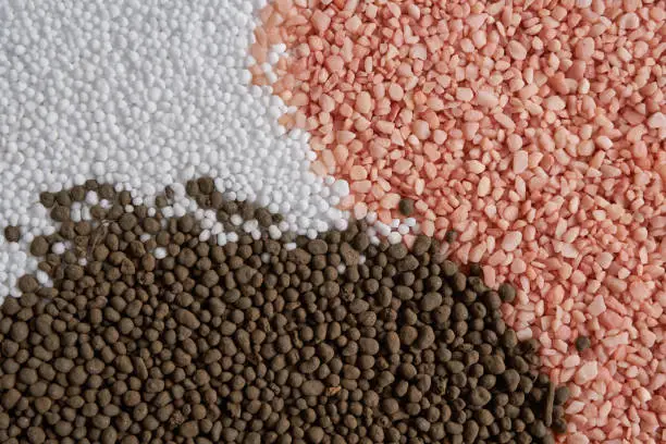 Photo of NPK : white ,black,pink,and colorful fertilizer for background. concept  :New years celebrate photo sets   for fertilizer or agriculture company .