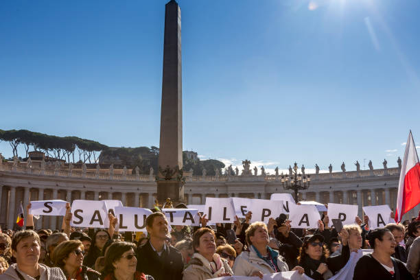 Pilgrims during Urbis et Orbis prayer Vatican, November 19, 2017: Pilgrims during Urbis et Orbis prayer on Sunday at Saint Peters Square. orbis stock pictures, royalty-free photos & images