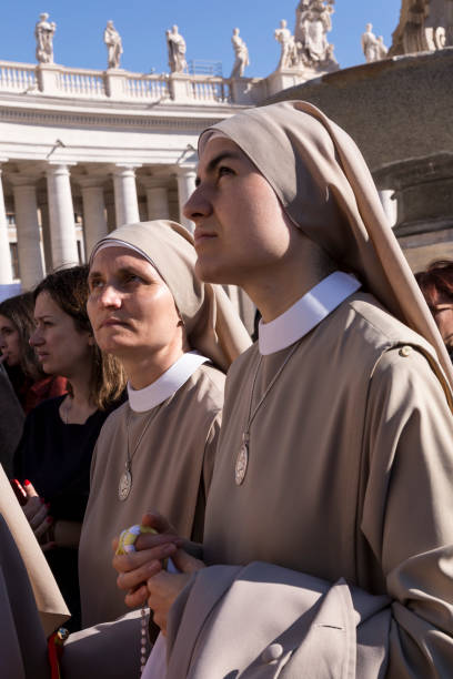 Pilgrims during Urbis et Orbis prayer Vatican, November 19, 2017: Pilgrim nuns during Urbis et Orbis prayer on Sunday at Saint Peters Square. orbis stock pictures, royalty-free photos & images