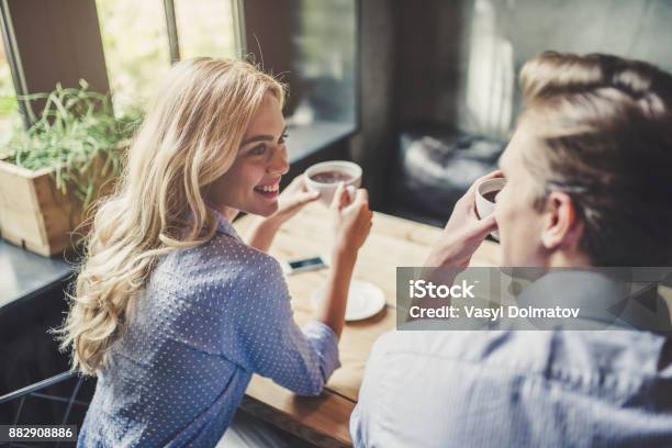 Couple In Cafe Stock Photo - Download Image Now - Dating, Flirting, Couple - Relationship