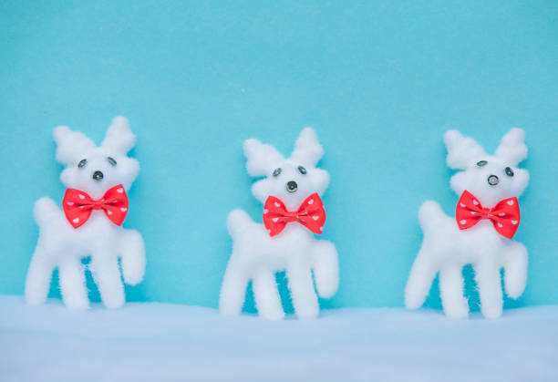 istock Christmas blue background with reindeer on snow for holiday cards 882913018