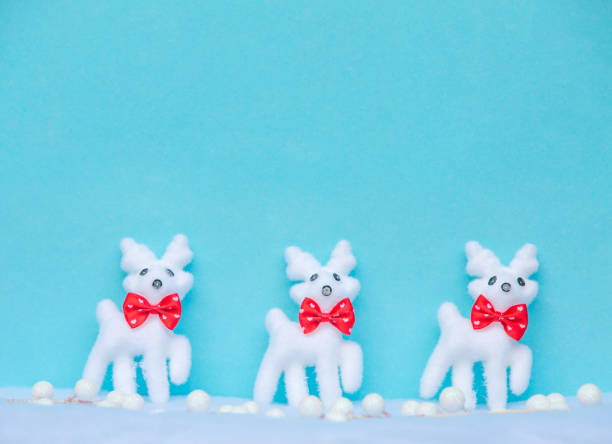 istock Christmas blue background with reindeer on snow 882917686