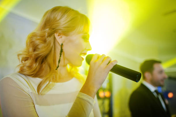 istock Musicial music live band performing on a stage with different lights. 882940786