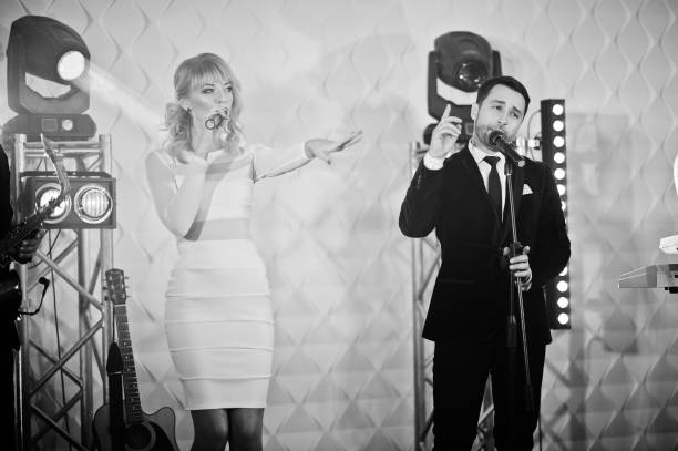 istock Musicial music live band performing on a stage with different lights. 882950316