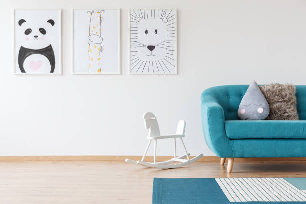 istock Kid's drawings in living room 882964372