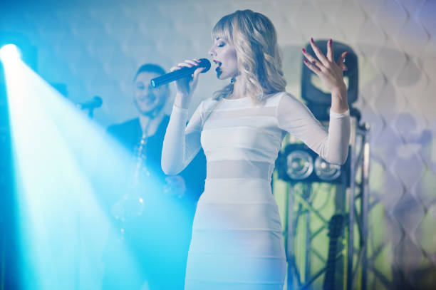 istock Musicial music live band performing on a stage with different lights. 882966860