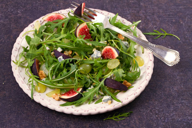 istock Grapes, figs, cheese, and arugula salad 882967058