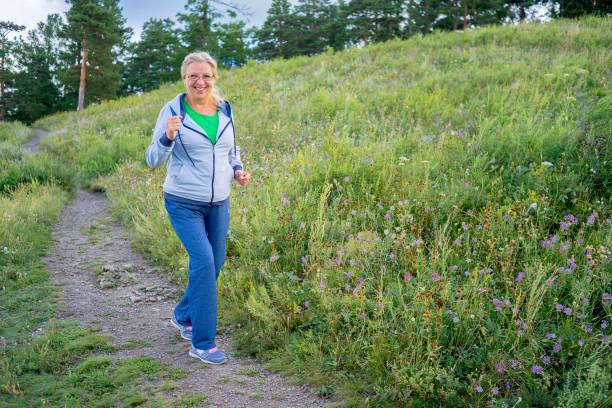 istock Elderly woman doing sport outside 882967616