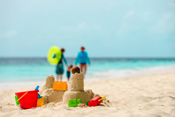 istock sand castle on tropical beach, family vacation 882970350