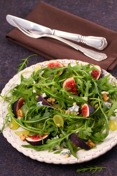 istock Grapes, figs, cheese, and arugula salad 882972438