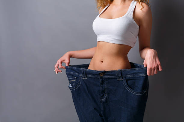 istock Woman wearing jeans much bigger size 882978918