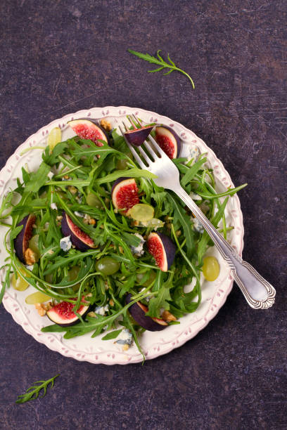 istock Grapes, figs, cheese, and arugula salad 882979608