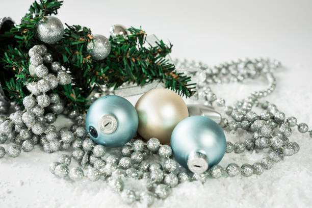 istock close up mini Christmas tree, with balls in blue and white, chain and star 882979758