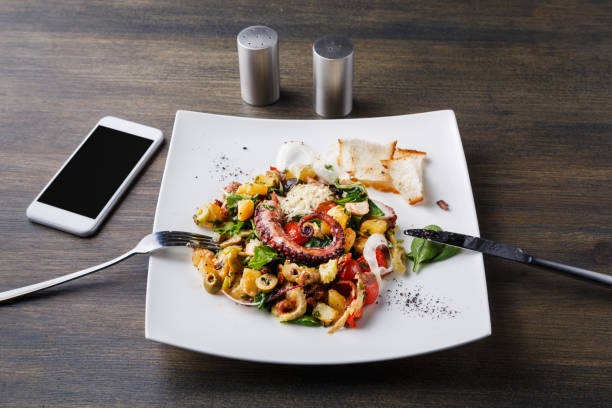istock Salad with octopus and vegetables top view 882979772