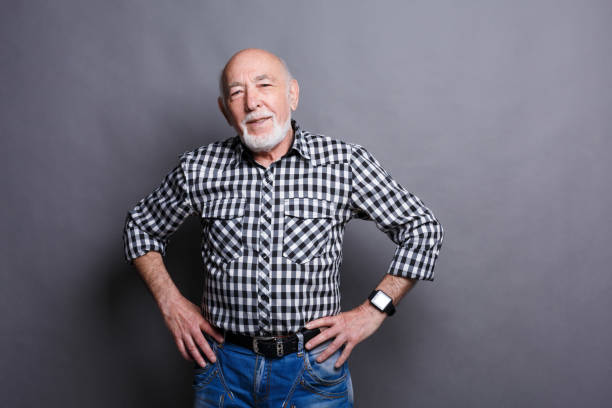 istock Serious senior man posing with hands on hips 882981882