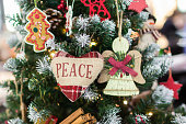 Merry Christmas and Happy New Year. Happy holidays. Christmas tree. Heart with inscription peace