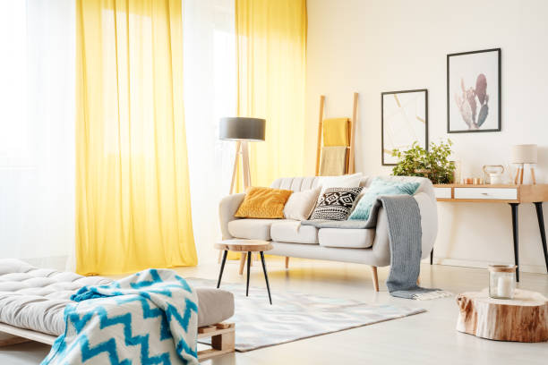 istock Living room with yellow curtains 882987894