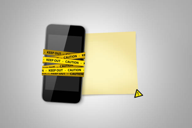 istock Black Smart Phone, Keep Out Tapes and Yellow Sticky Paper 882998828