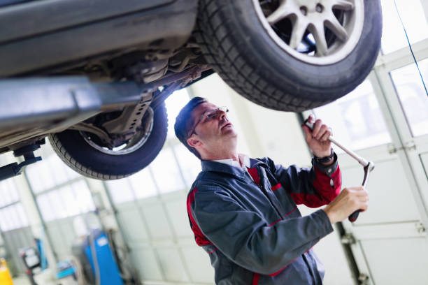 istock Car mechanic working at automotive service center 883005252