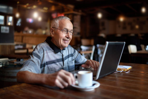 istock Senior man in coffee shop 883005760