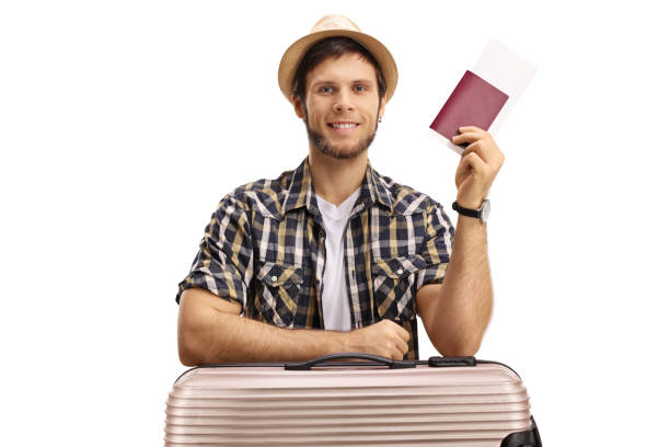istock Tourist with a suitcase and a passport 883005814