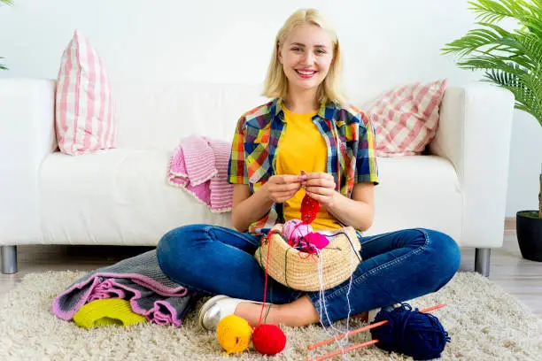 A portrait of a girl knitting at home