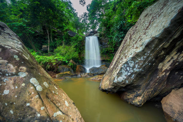 istock Beautiful waterfall in green forest in jungle, Thailand 883019380
