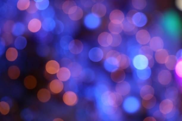 istock Blue Nightlights defocused blurred background decorate on tree for Christmas celebrate and New Year festival 883019704