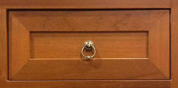 istock Wooden drawer with brass knob 883032124
