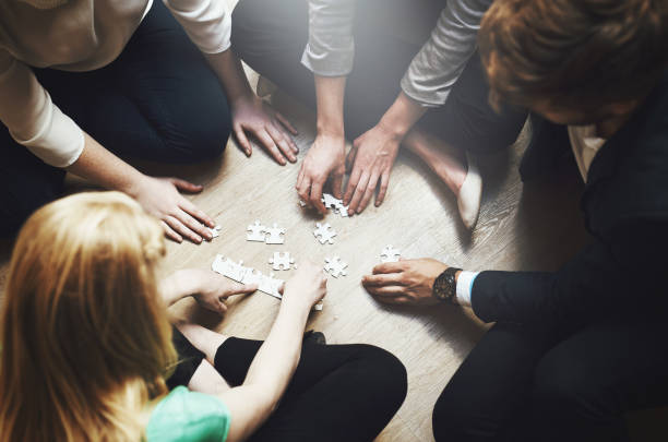 istock Putting the pieces together as a team 883034422
