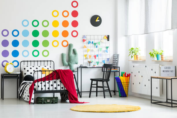 istock Colorful kid's bedroom with clock 883041336