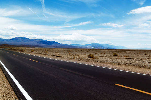istock highway in the desert, mountains and beautiful sky 883041946