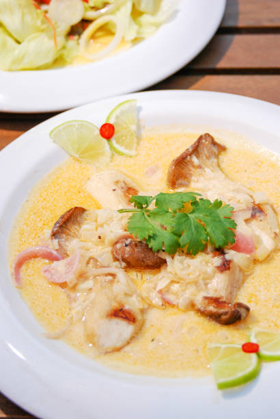 istock spicy hot chicken  curry with coconut milk soup and lemon 883042358